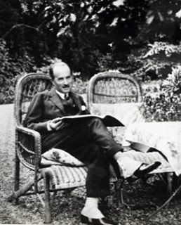 Rene Gimpel sitting in a wicker chair